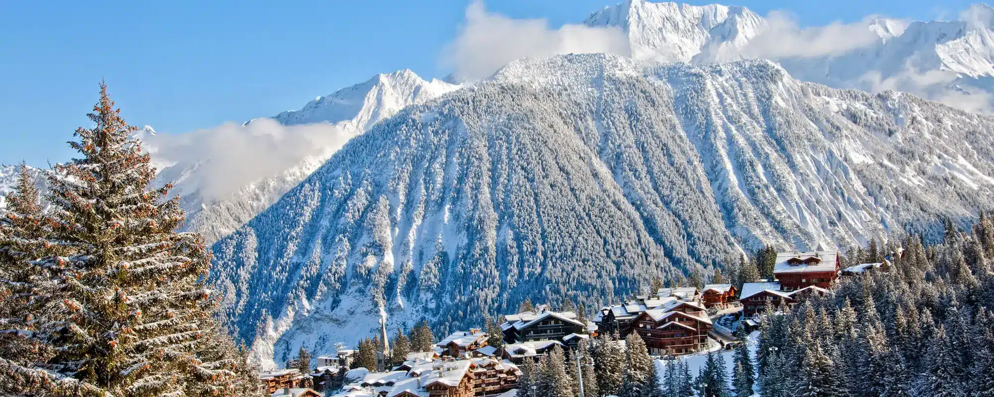 Snow-covered chalets and mountains in Courchevel