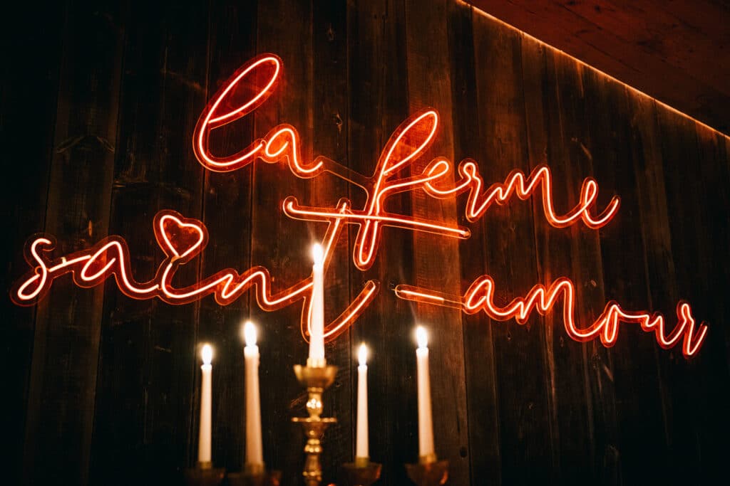 La Ferme Saint-Amour Courchevel dining room and neon sign